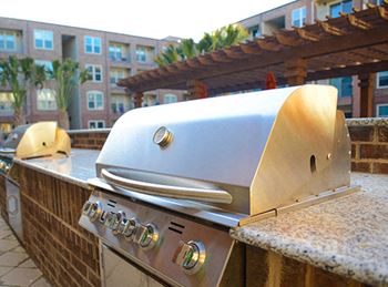 Outdoor gas grilling kitchen with picnic areas
